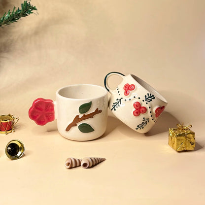 Two ceramic mugs with decorative designs.