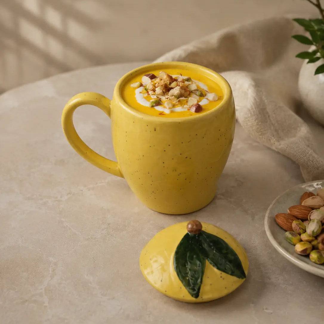 Yellow mango mug with a lid